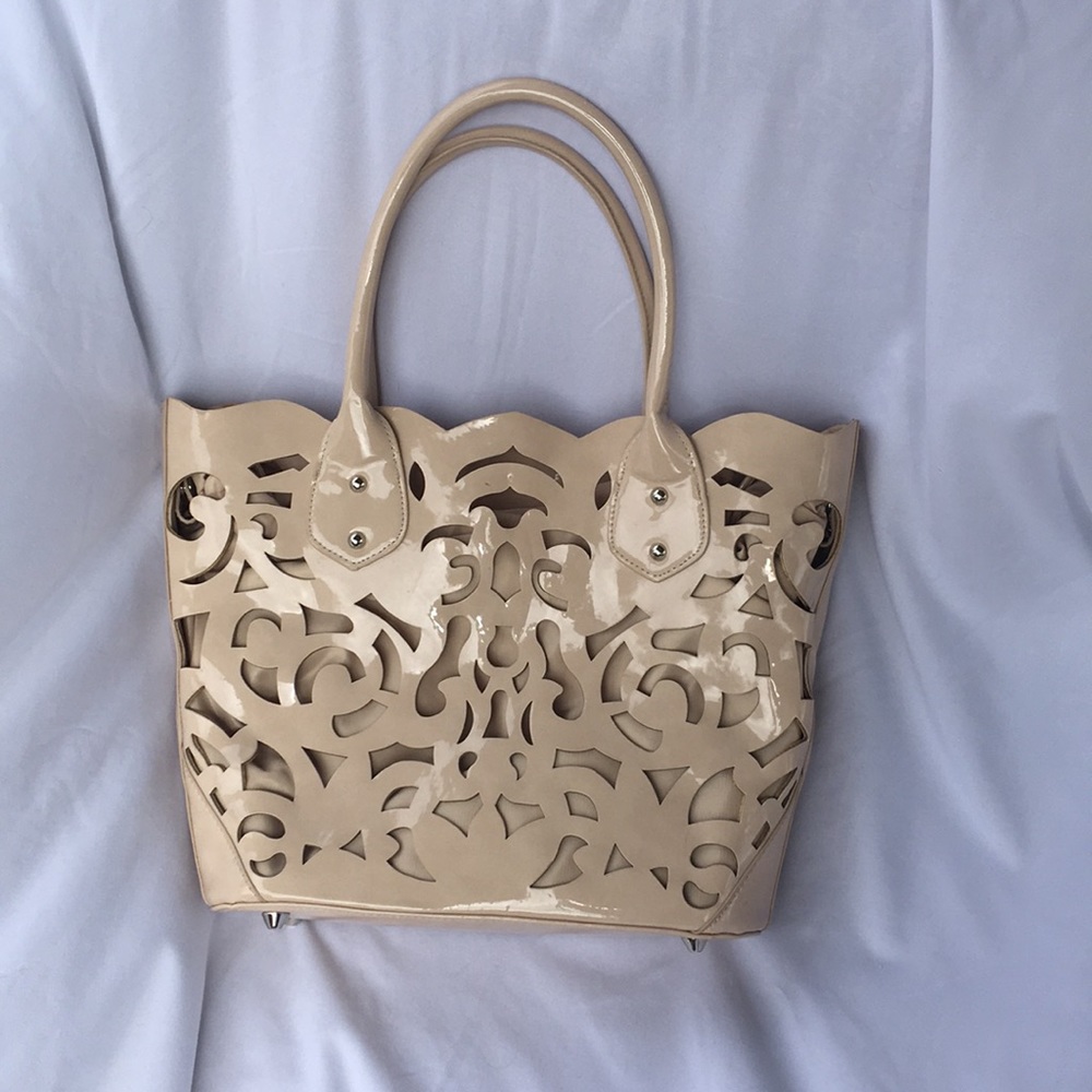 Laser cut nude handbag